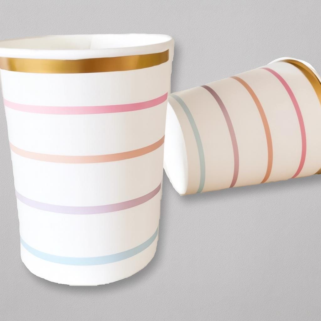 Two paper cups with colorful stripes on a gray background