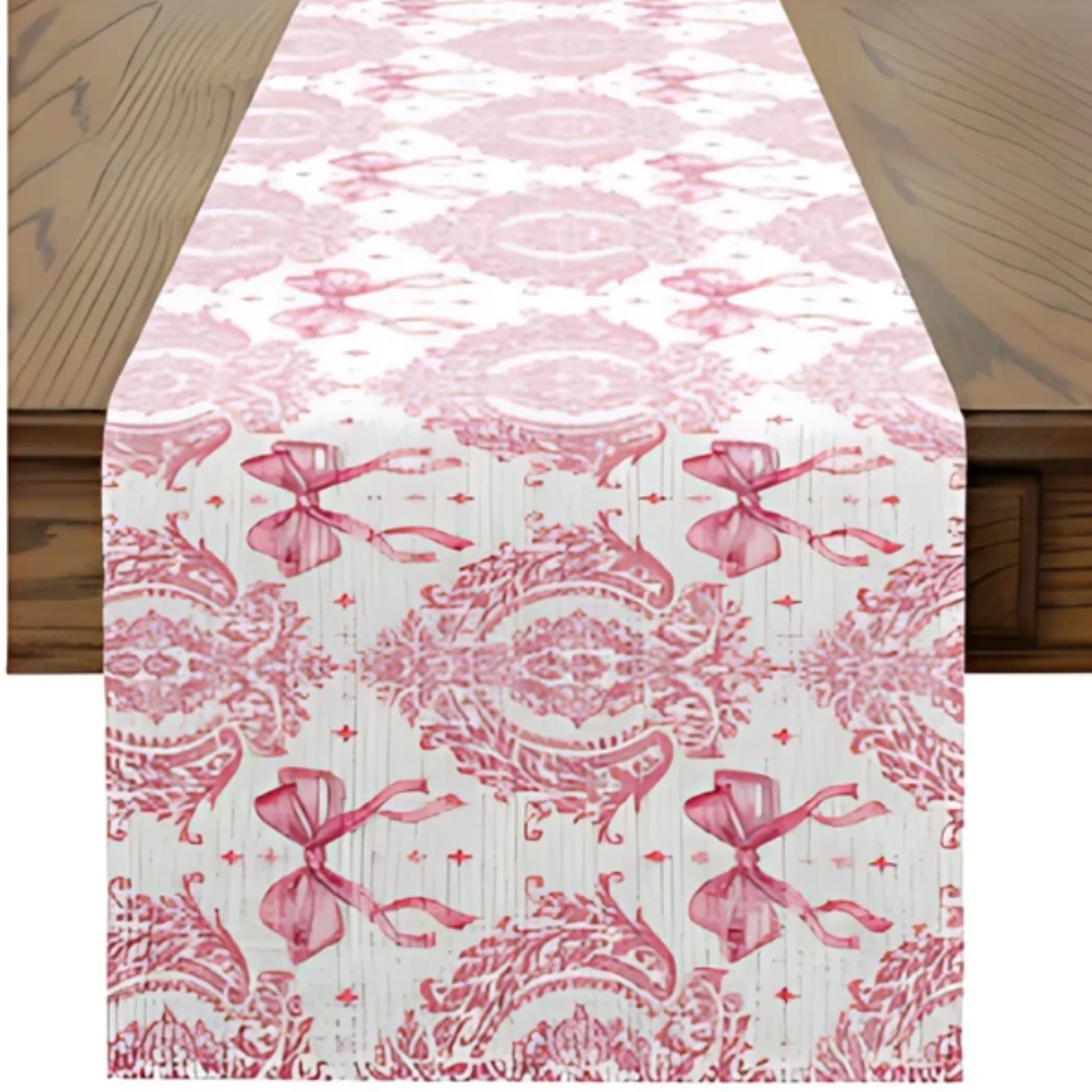 Table runner with pink floral and bow pattern on a wooden table
