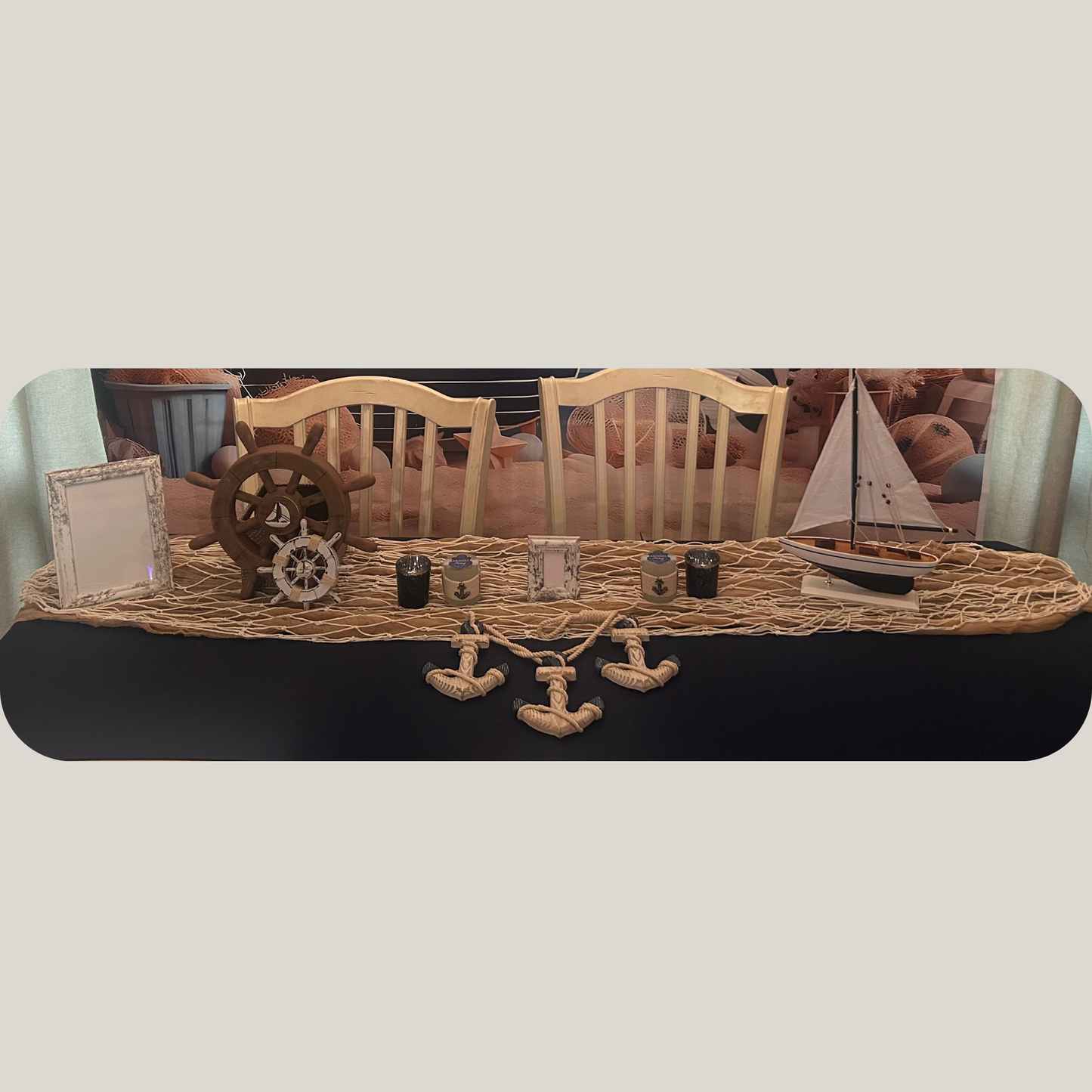Decorative table runner with nautical-themed items on a dining table.