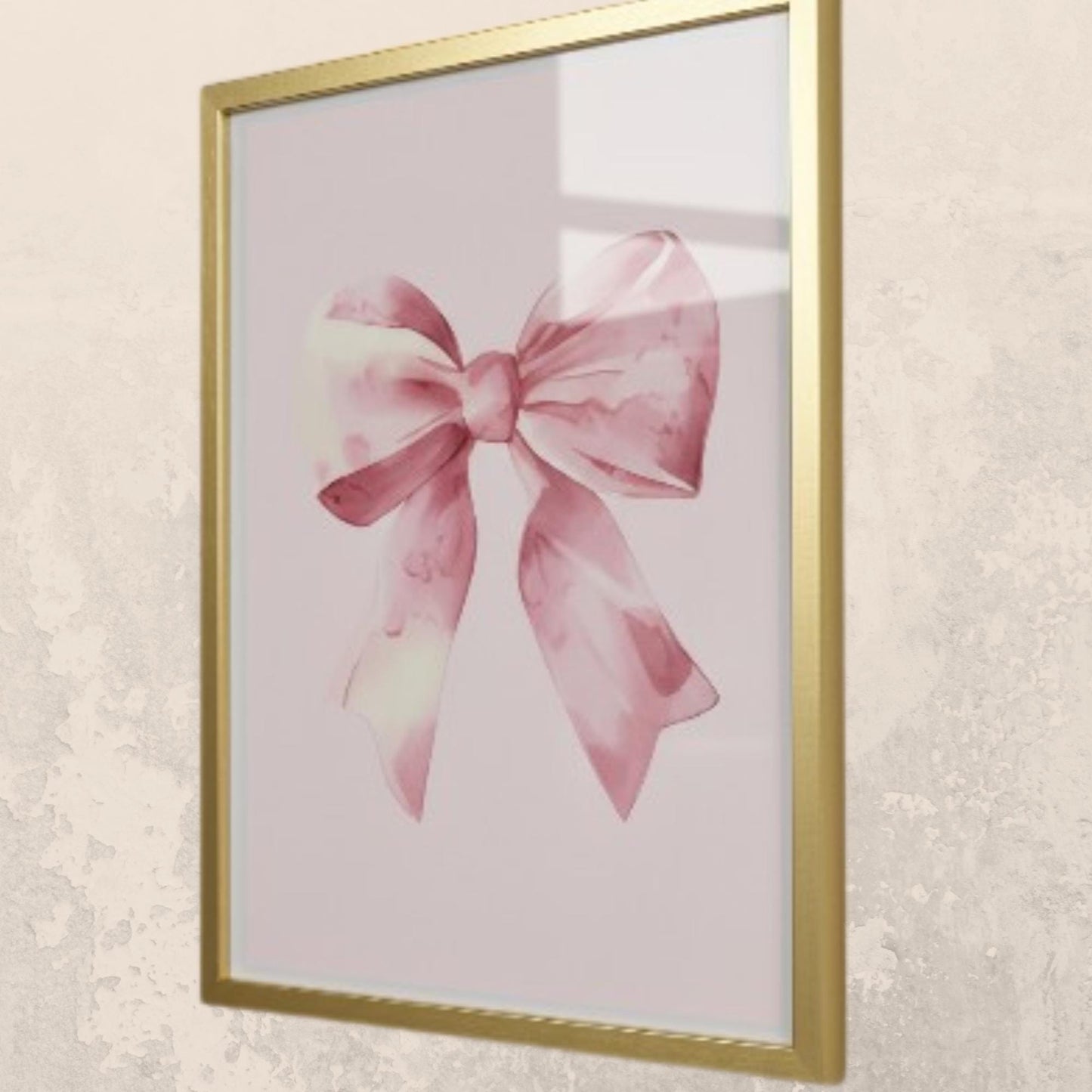 Framed artwork of a pink bow on a light background